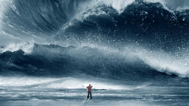 huge-tidal-wave-crashing-onto-the-beach-with-man_HQfk4yMxA